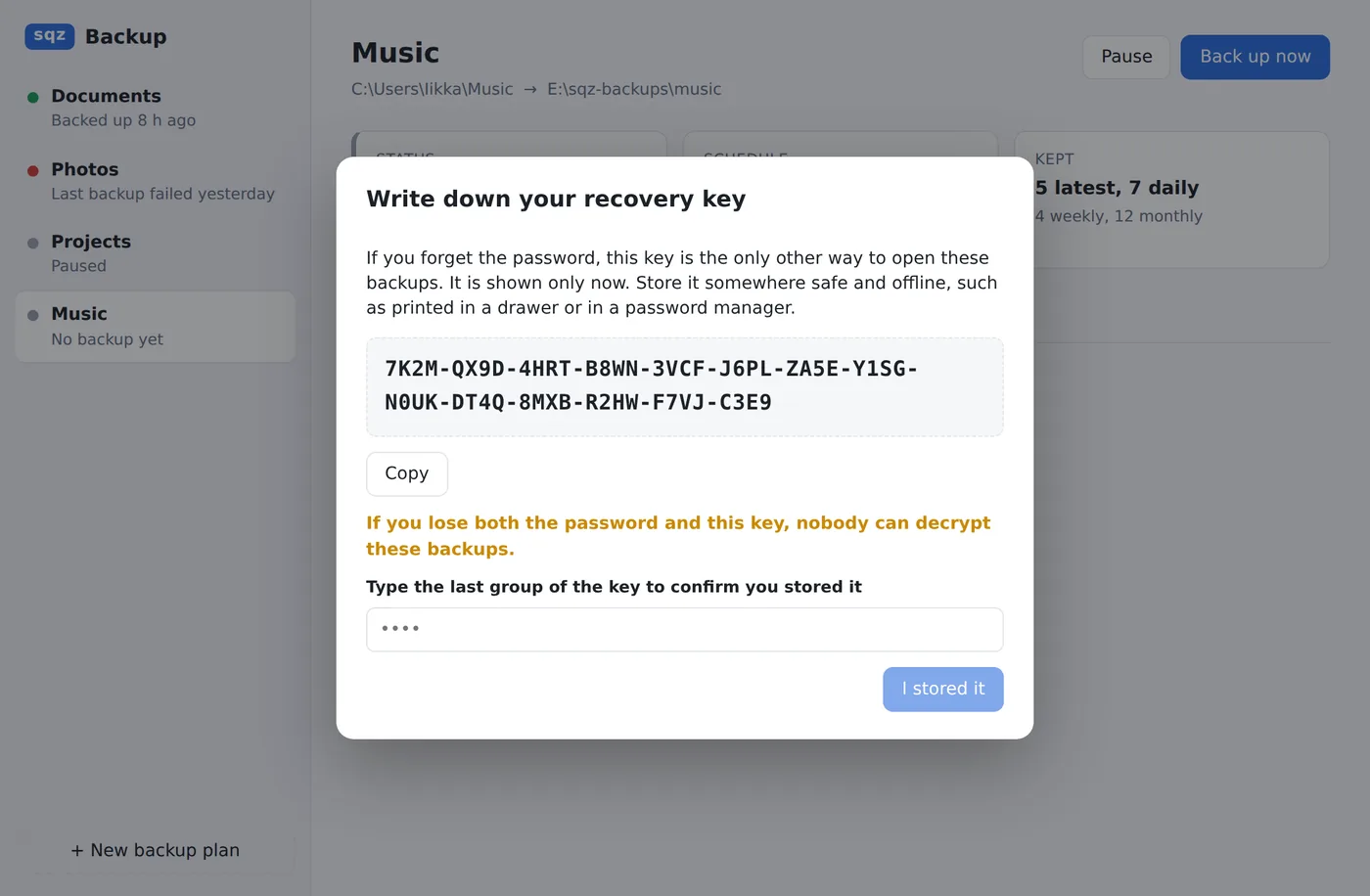 A dialog showing the recovery key and asking you to type its last group to confirm you saved it.